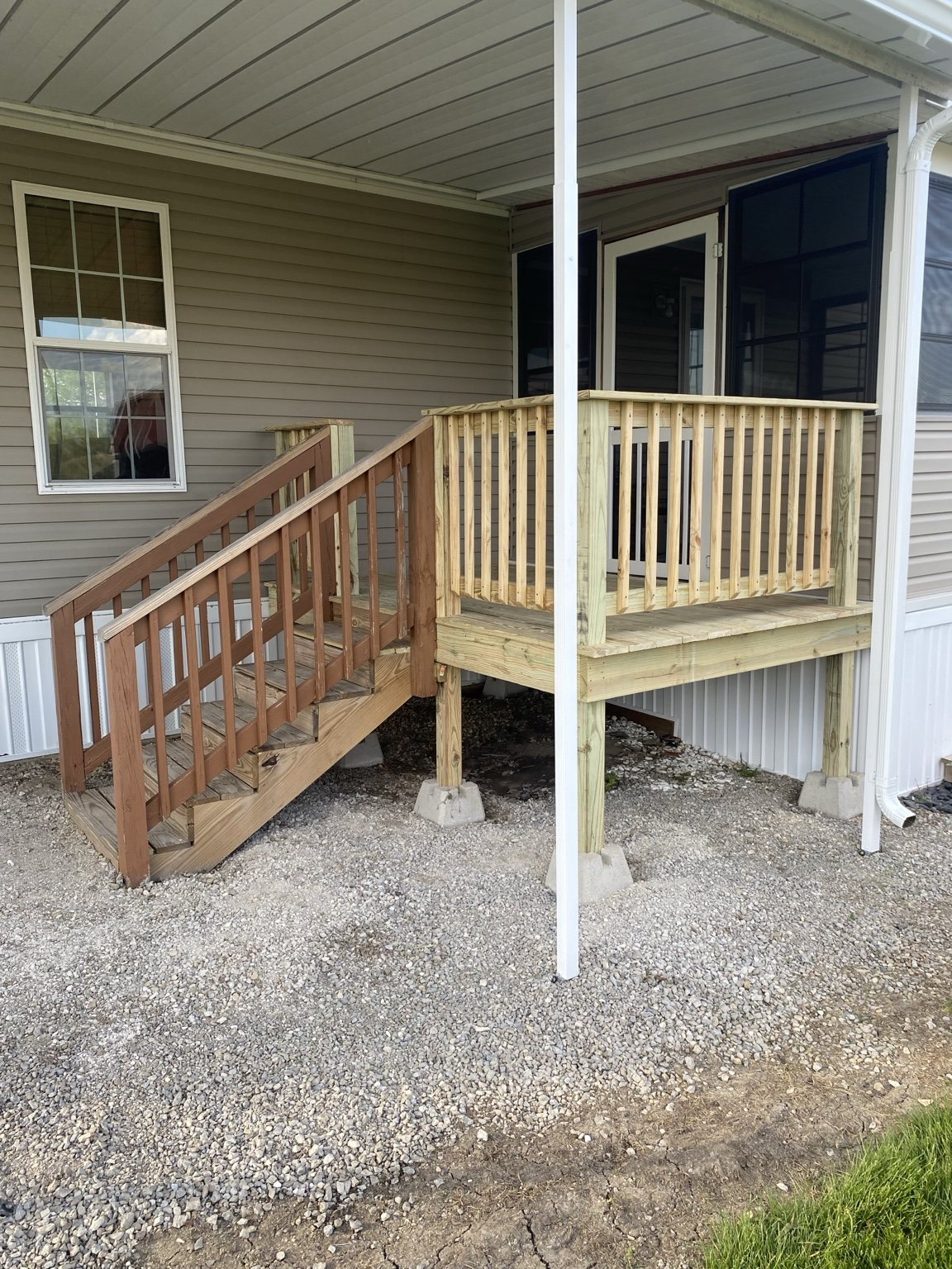 Covered porch with new wooden steps and railings